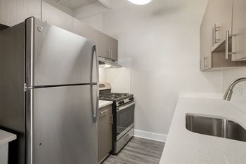 Updated white or grey cabinet finishes in renovated apartment homes